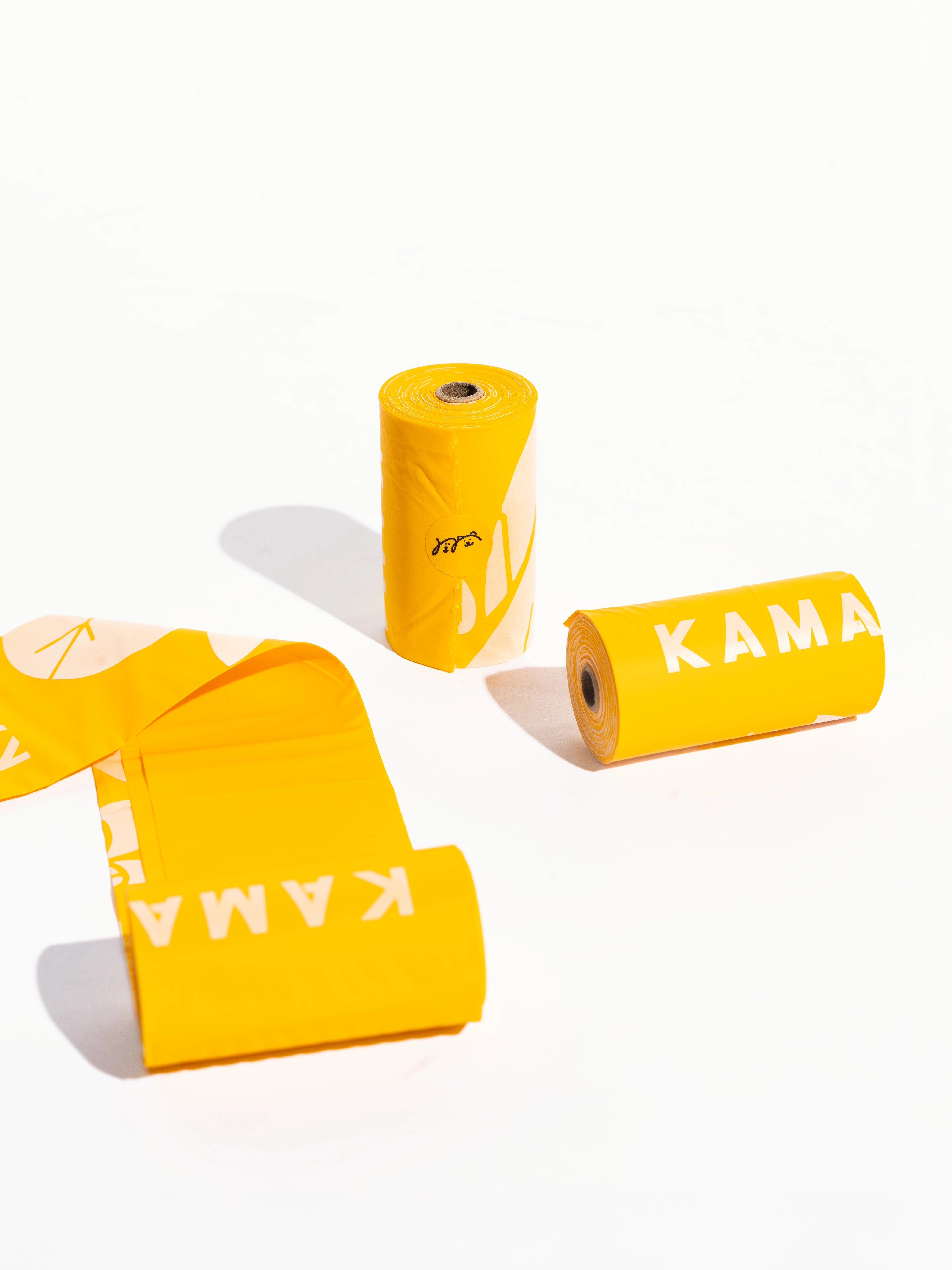 three-rolls-of-biodegradable-kamamuta-dog-poop-bags-on-floor three-rolls-of-biodegradable-kamamuta-dog-poop-bags-on-floor