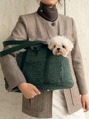 woman-holding-kamamuta-medog-green-mini-tweed-tote-bag-with-white-small-dog-inside-looking-forward