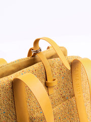 close-up-of-yellow-kamamuta-mini-tweed-tote-bag-leather-and-metal-hardware-details