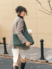woman-walking-on-street-carrying-kamamuta-medog-green-mini-tweed-tote-bag-with-small-dog-inside