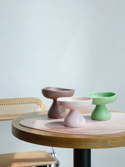 brown-pink-green-kamamuta-mushroom-bowls-placed-on-table