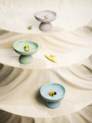 lilac-green-blue-kamamuta-mushroom-bowls-displayed-flat-on-different-table-surfaces