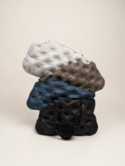 white-brown-blue-black-kamamuta-airy-pet-bags-stacked-together