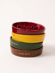 red-yellow-green-brown-kamamuta-bone-slow-feeder-bowls-stacked-together