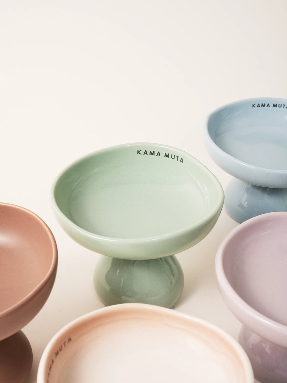 close-up-different-color-kamamuta-mushroom-bowls-placed-on-floor