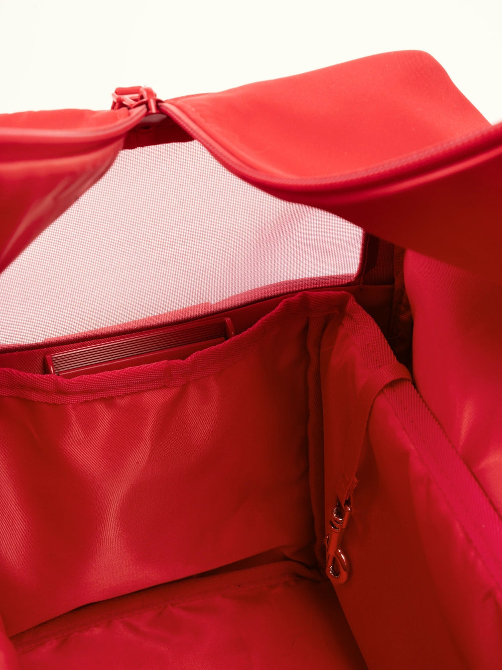 close-up-view-from-inside-red-kamamuta-pet-shadow-bag-looking-out-through-breathable-mesh