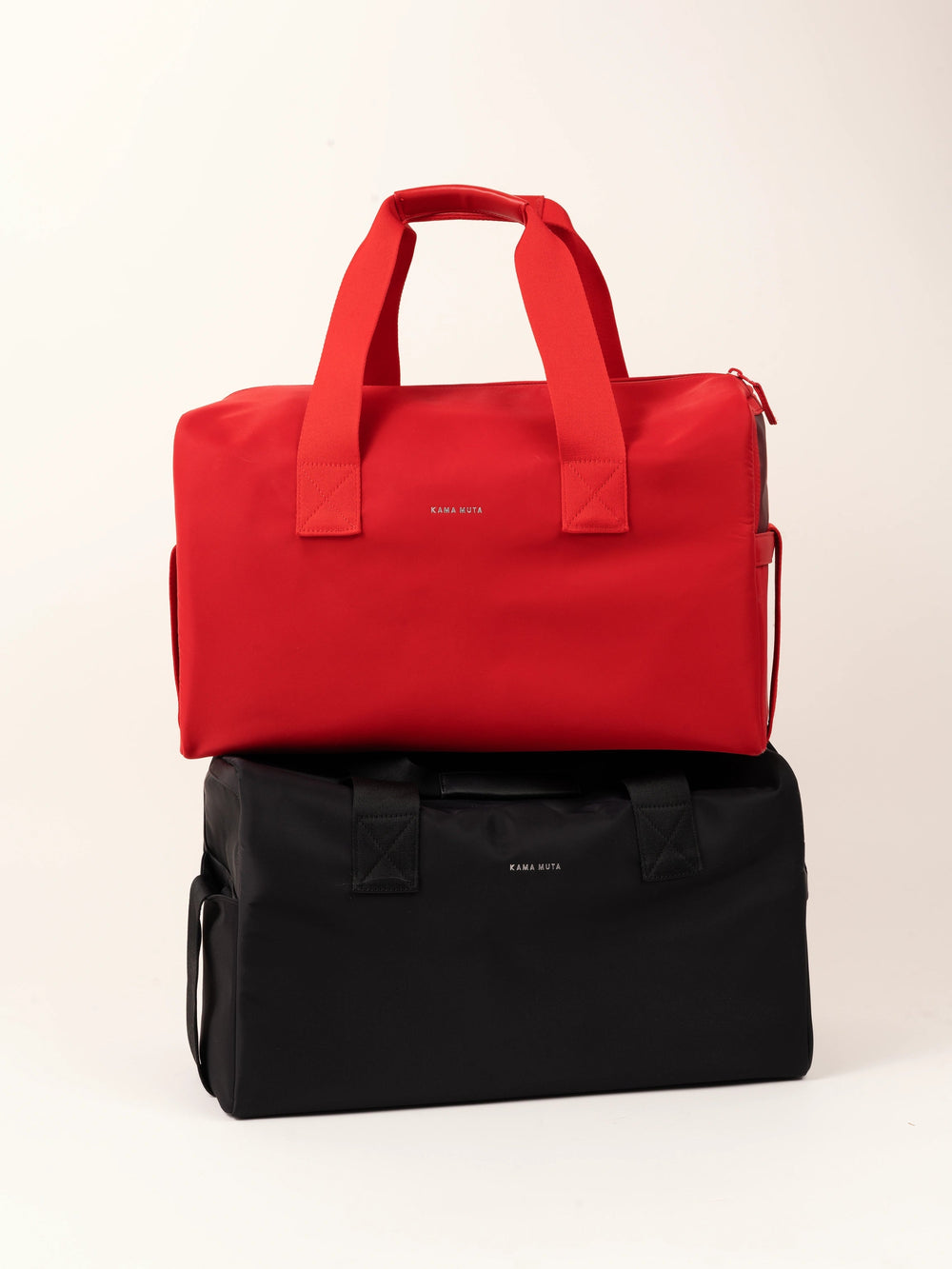 black-and-red-kamamuta-pet-shadow-stealth-whisper-carriers-bags-stacked-together-on-solid-background